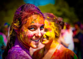 A face adorned with the colors of Holi